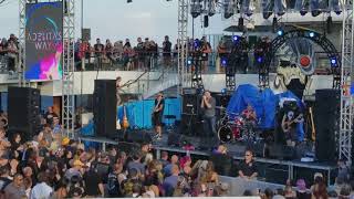 Adelitas Way performing The Good Die Young aboard Shiprocked 2018.