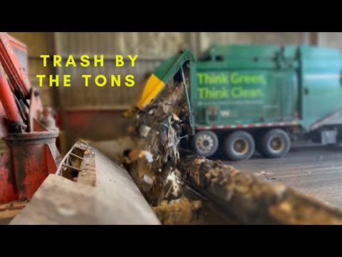 Watch Garbage trucks dumping Tons of Trash in the Hole!