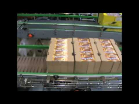 Cadenceur à écluse pour les produits à fond plat et rigide_1