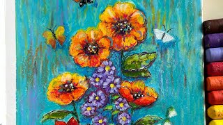 Colouring with oil pastels in a coloring book by Johanna Basford