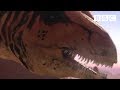 A deadly Allosaurus ambushes its prey | Planet Dinosaur - BBC