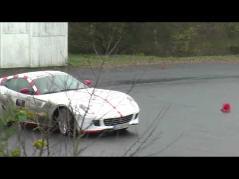 Drifts Ferrari F599 GTB on watered track