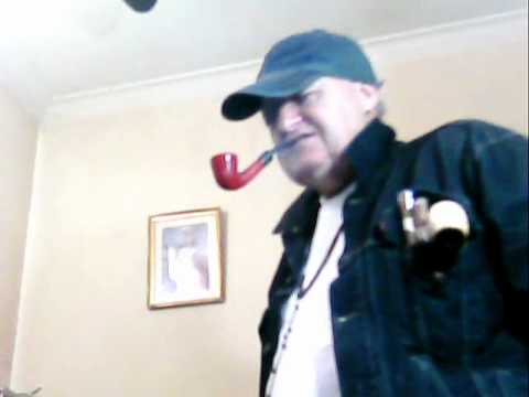 Smoker, of Red Paronelli, Pipe Tobaccos, Curved; with Jacket Blue Jeans Levi'  s.