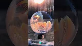 A soap bubble freezes into a stunning ice crystal in the cold! #FrozenBubble #WinterMagic