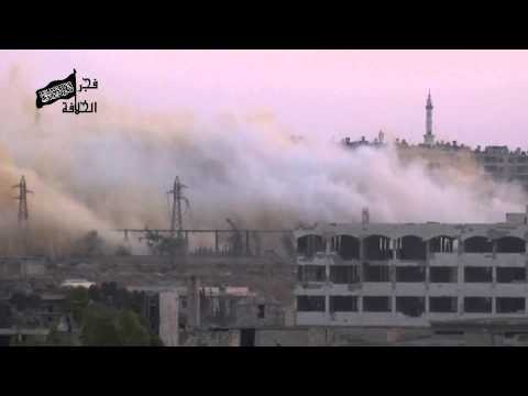 استهداف وتدمير مبنى تتحصن فيه قوات النظام في جبهة جمعية الزهراء بواسطة نفق مفخخ من قبل كتائب فجر الخلافة