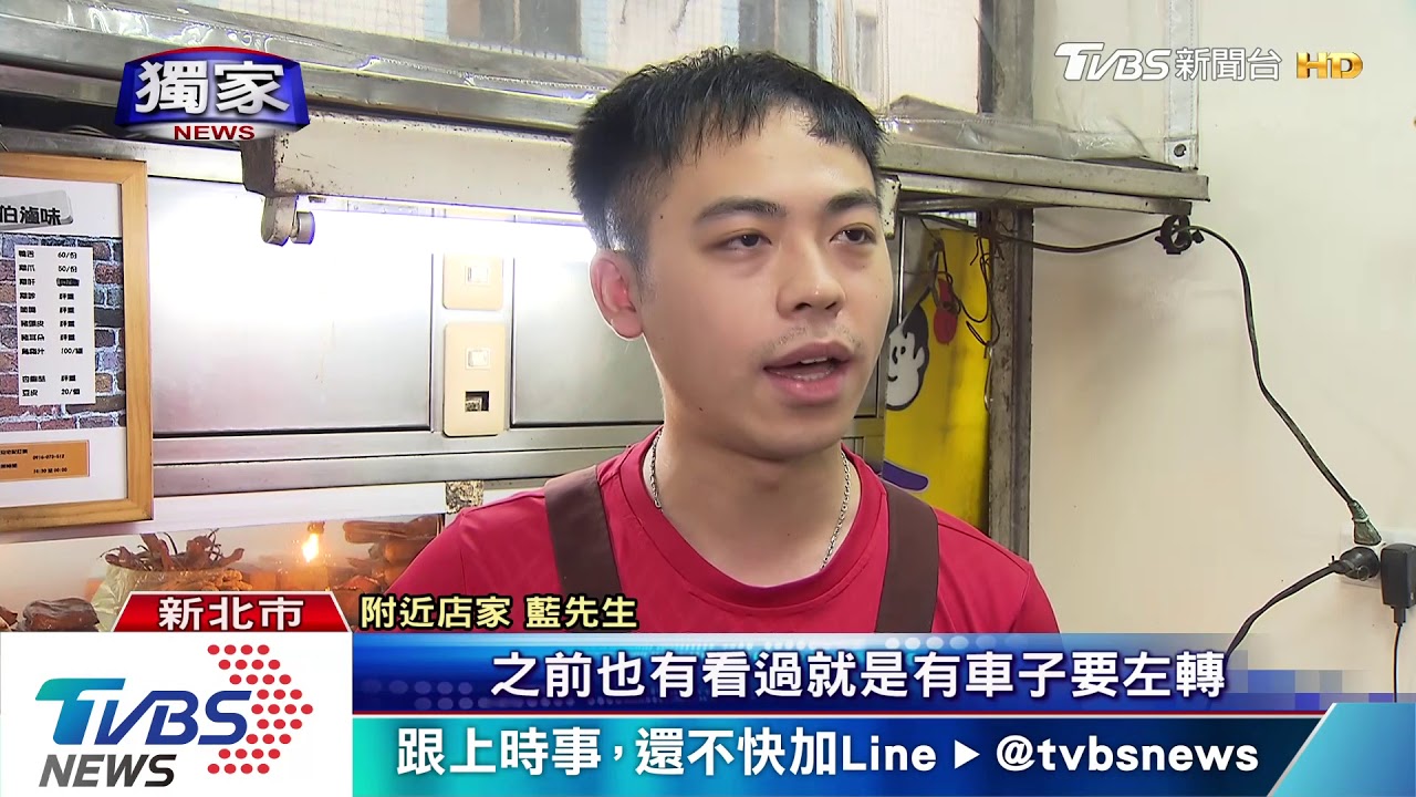 機車闖紅燈把手勾人! 路人遭絆倒地傷