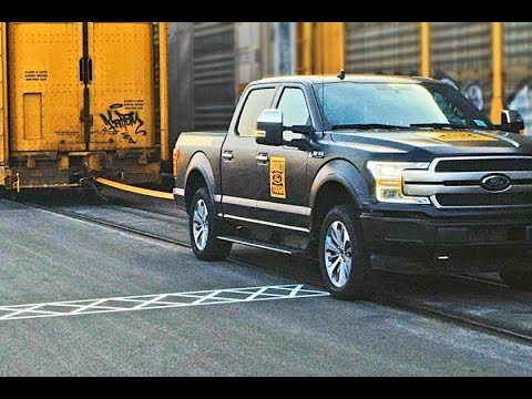 Ford teases all electric F-150 pickup truck by pulling a million-pound train