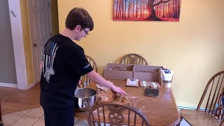 Young entrepreneur using homemade dog treats business to help animal shelter