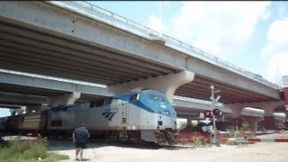 preview picture of video 'Amtrak Train Silver Star Horn Under Bridge Dust Over Road'