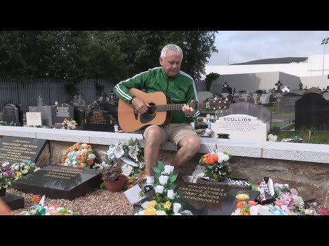 Bik McFarlane sings 'a song for Marcella' at the republican plot in Milltown Cemetery.