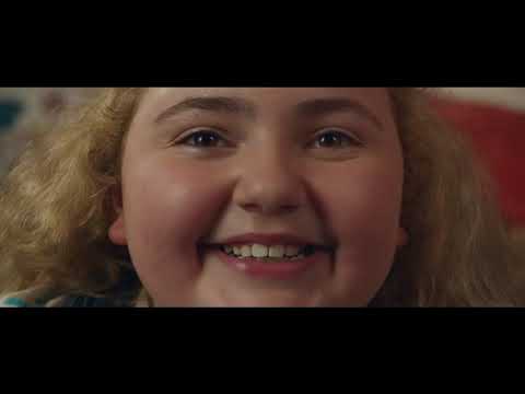 Trailer frame: Natalie mid-spin during a choreographed street number—joy used as a story device