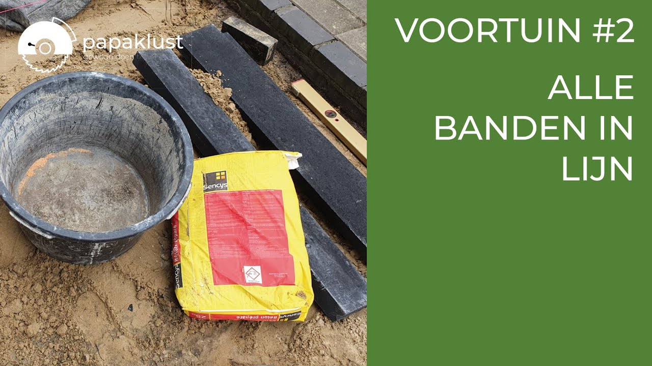 Voortuin #2 Opsluitbanden in de beton stellen