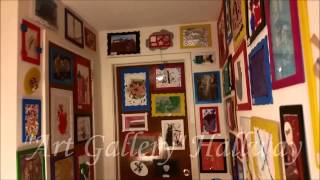 Our upstairs hallway had just plain white walls and I wanted to liven it up.
My children have PLENTY of art work to display so I decided to turn our upstairs hallway in a their very own “Art Gallery”