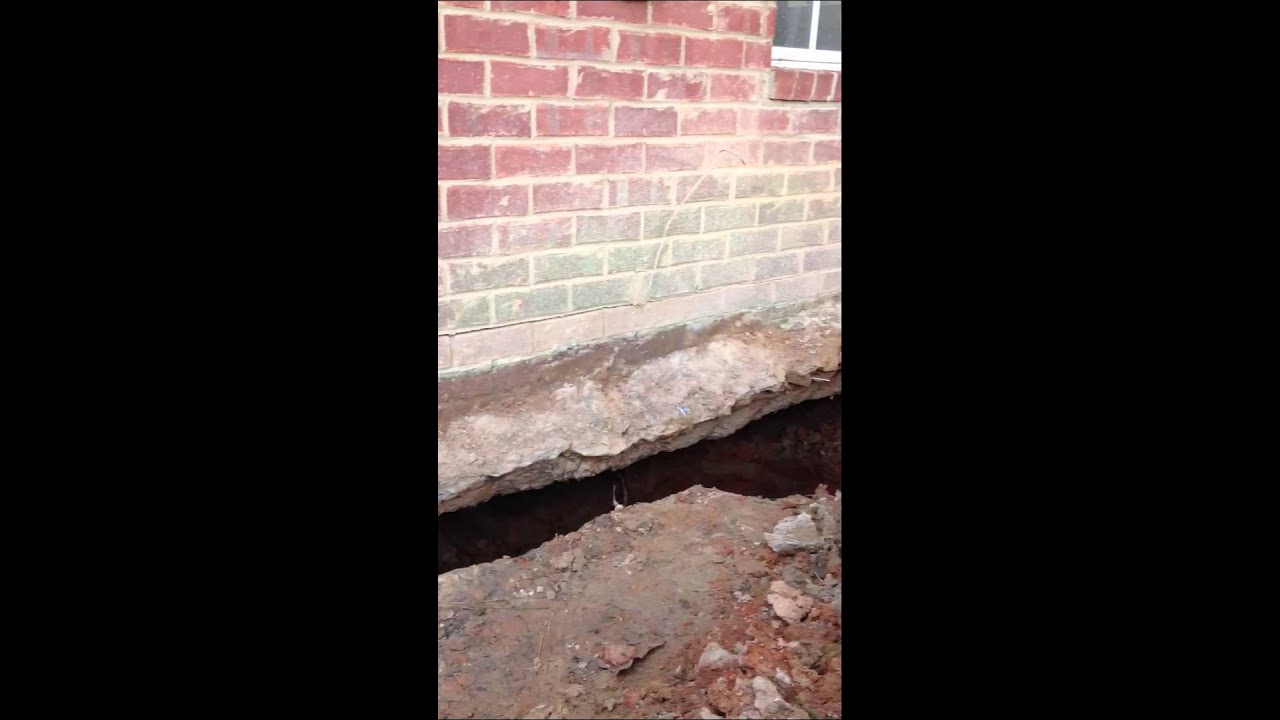 Sinkhole under existing foundation of house