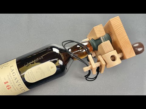Lock Picker Tries To Pick A Bottle Puzzle Lock So He Can Drink A Bottle Of Scotch