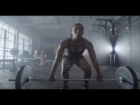 Medium shot slow mo tilt-down tilt-up men and women | Video Footage | Shutterstock