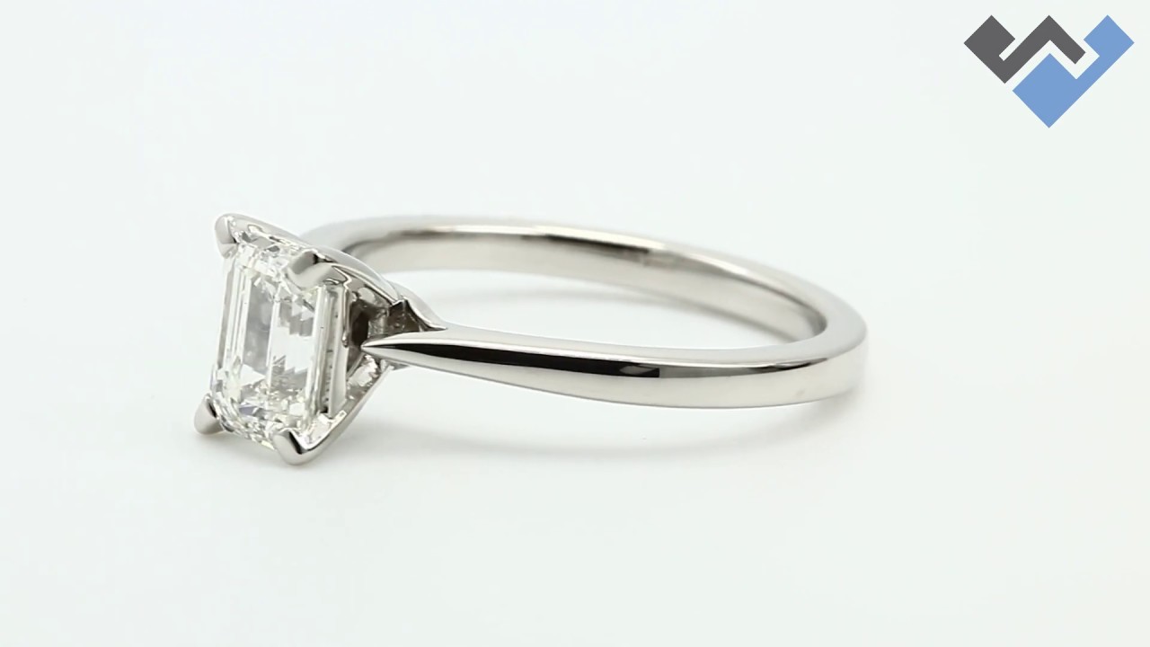 1692 - 0.90 Carats Emerald Cut Petite Diamond Solitaire Engagement Ring In Platinum.