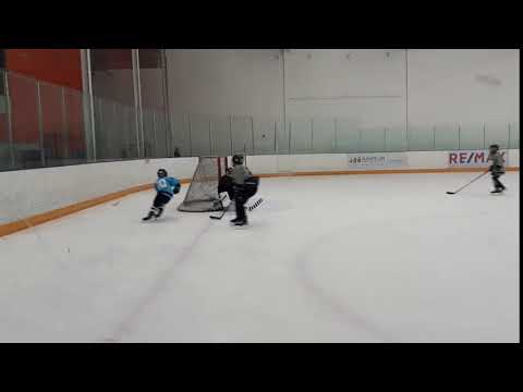 Wrap around save. Cedric goalie age 9.