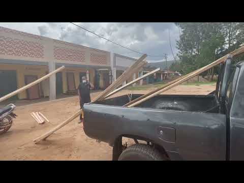 Building Widow's Home - Picking Up Timber for Roof
