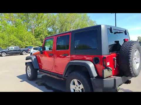 2012 Jeep Wrangler Unlimited 4WD 4dr Rubicon in Red for sale at Finch Chrysler Dodge Jeep Ram Ltd in London, ON