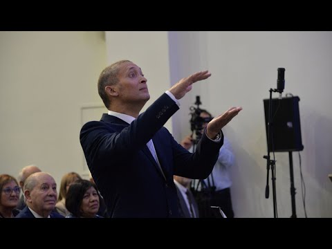 District Apostle Lambert conducting a choir in Montevideo, South America