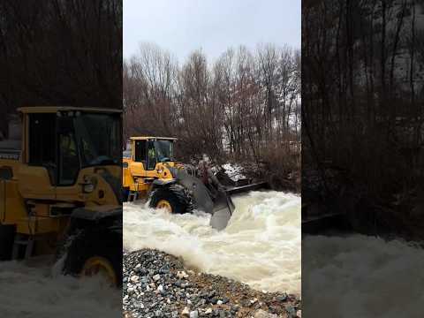 The giant excavator is crossing the stream. #excavator