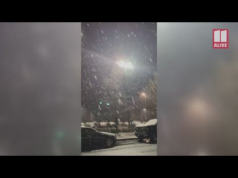 Snow collects atop cars in Lawrenceville