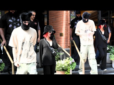 Megan Fox Conceals Vibrant Red Hair With Machine Gun Kelly Sports Matching Ski Cap in NYC