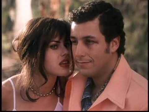 Official trailer still for The Waterboy showing Bobby Boucher on a sun-baked field with Mud Dogs uniforms