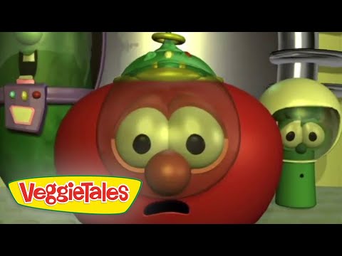 Red tomato character from VeggieTales with wide eyes and open mouth, in a lab-like setting with a VeggieTales logo visible.