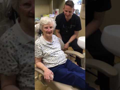 Elderly woman with nasal cannula sitting in dental chair
