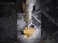 desktop waterjet cutting a padlock