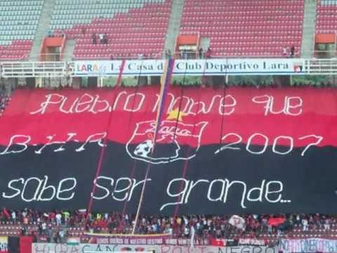 "DEPORTIVO LARA vs yaracuyanos entrada del equipo himno nacional." Barra: Huracan Roji-Negro • Club: Deportivo Lara