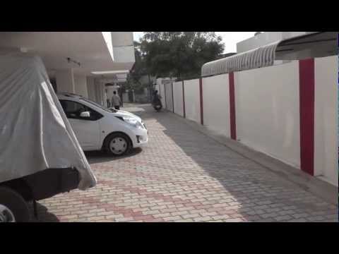 Baba takes Rishi for a ride on his motor scooter.