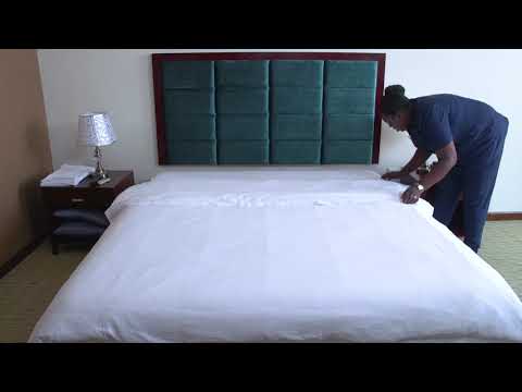 Housekeeping - Level 3 - Making the bed and dusting the guest room 2 of 3
