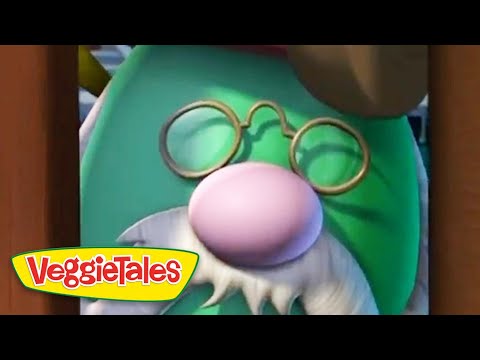 Close-up of a green cartoon character with a pink nose, round glasses, and a white beard; VeggieTales branding in the corner.