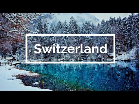 4K Aerial Flight Over Snowy Swiss Alps. Snowy Mountain Peaks, 4K UHD.