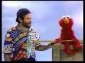 Robin Williams Gives A Stick To Elmo