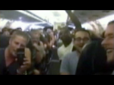 Stuck Passengers Sing 'I Believe I Can Fly' on Tarmac