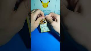 Peeling a Pokemon GO Ditto Card