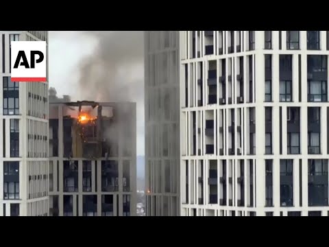 Video appears to show a drone hitting a building in Kyiv, Ukraine