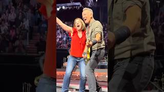 Bruce Springsteen invites a fan to dance during “Twist and Shout” at the Kia Forum (April 4, 2024)