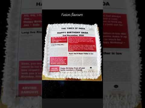 Newspaper theme cake with personalised messages