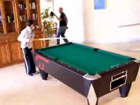 Pool trick shot with plant and hat