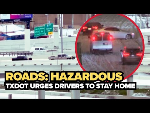 DFW road conditions: Cars struggle along I-30 near I-35E in Downtown Dallas