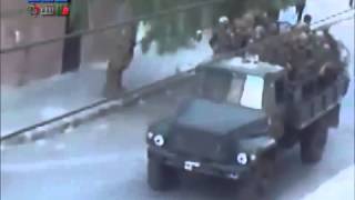 preview picture of video '20110831 - Homs City - Army trucks filled with soldiers and armored vehicles entering the city'