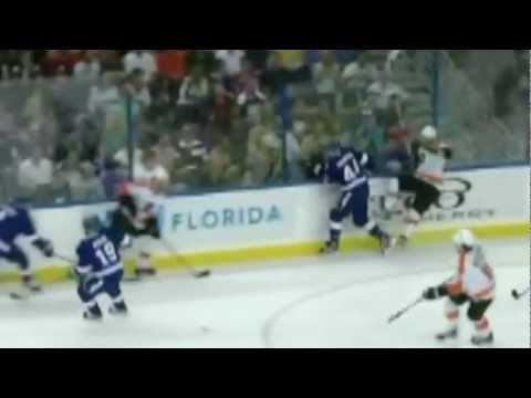 Nate Thompson crunches Andrej Meszaros