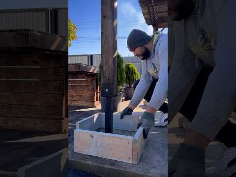 A creative way to build a concrete post with river stones