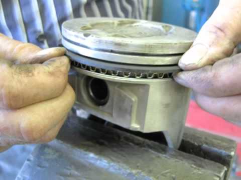 Installing pistons, 302 Ford.
