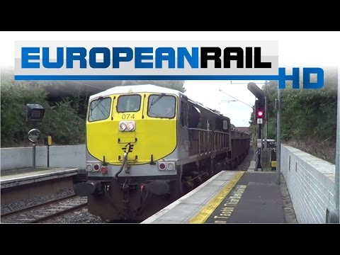 Irish Rail 071 loco 074 + ore wagons pass Harmonstown